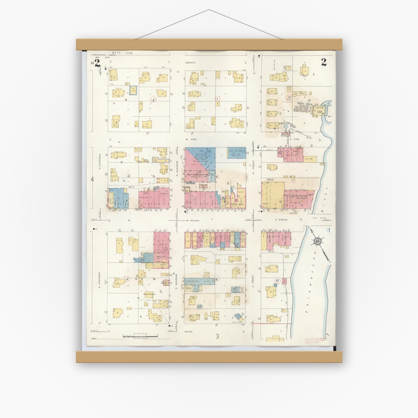 Old map wall art mockup — magnetic wood frame on white wall — Sanborn Fire Insurance Map from Chesaning, Saginaw County, Michigan (1944), Sheet #0002