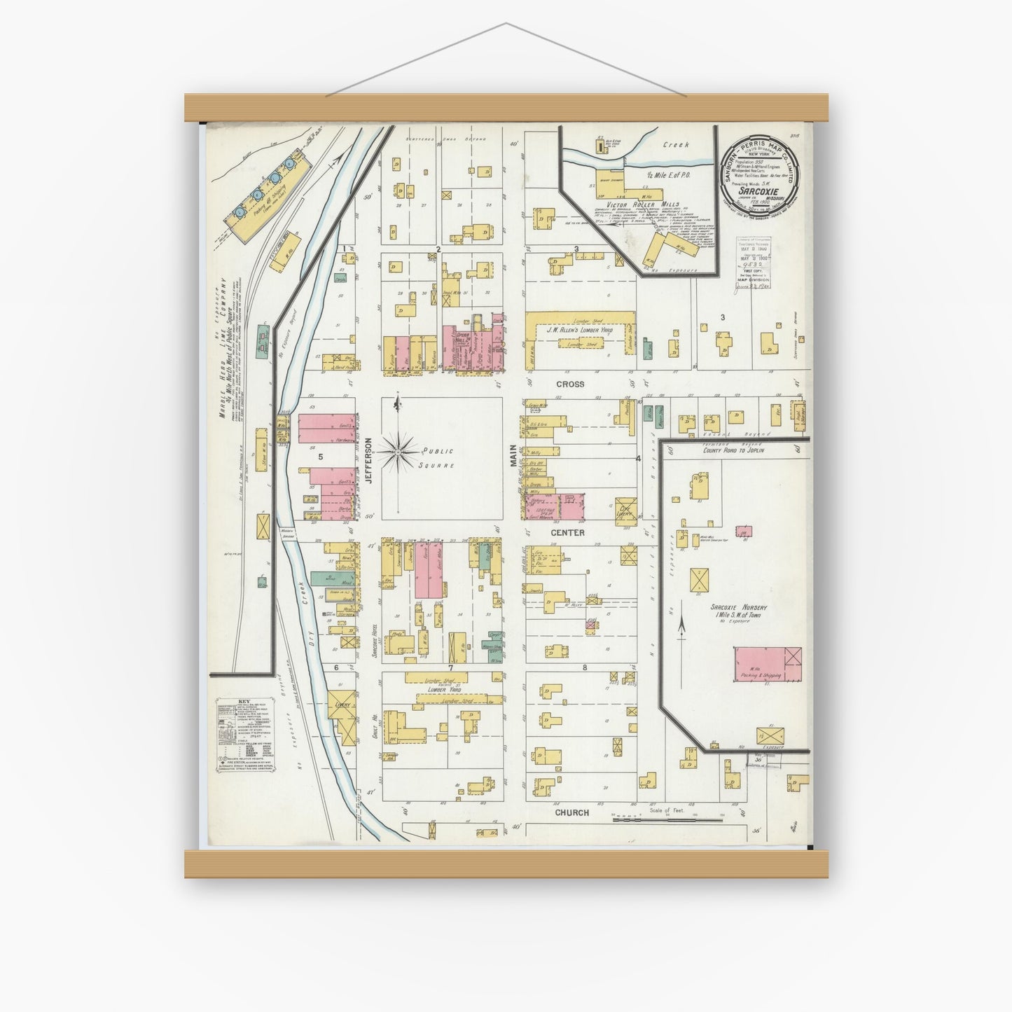 Old map wall art mockup — magnetic wood frame on white wall — Sanborn Fire Insurance Map from Sarcoxie, Jasper County, Missouri (1900), Sheet #0001