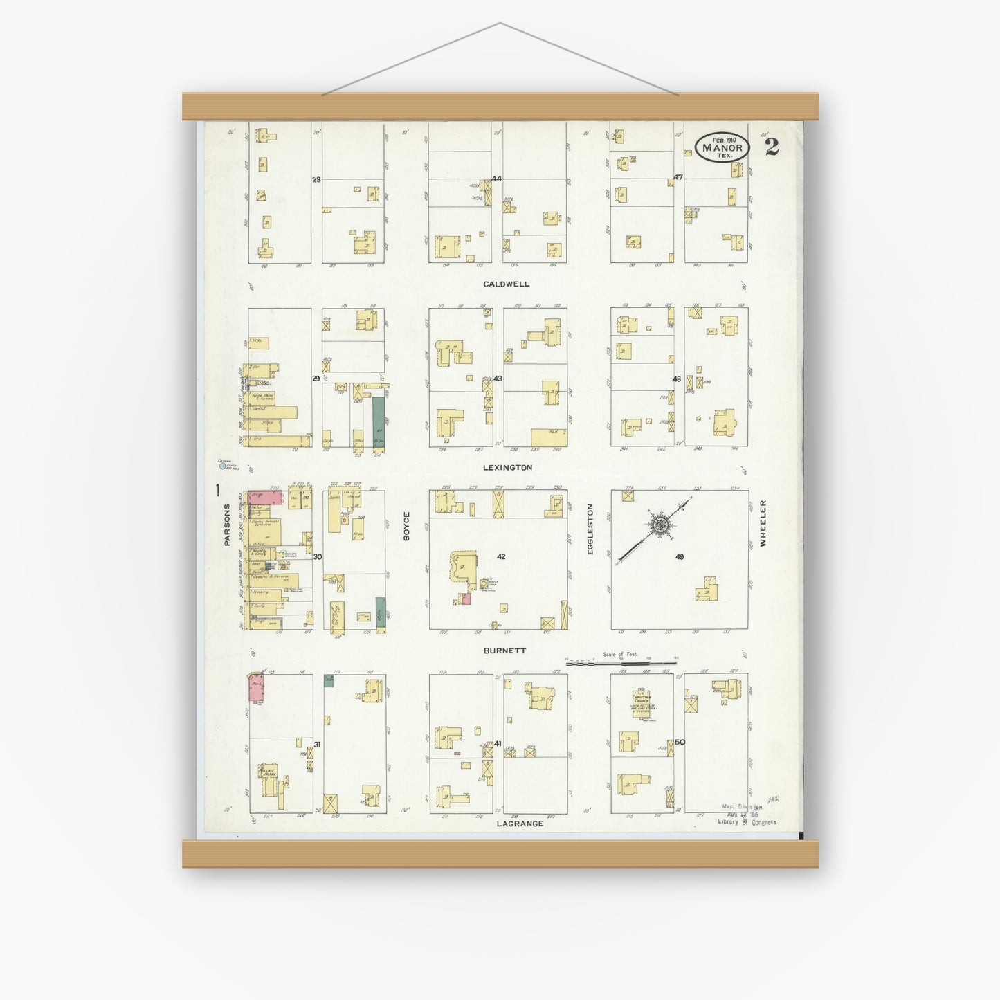Old map wall art mockup — magnetic wood frame on white wall — Sanborn Fire Insurance Map from Manor, Travis County, Texas (1910), Sheet #0002