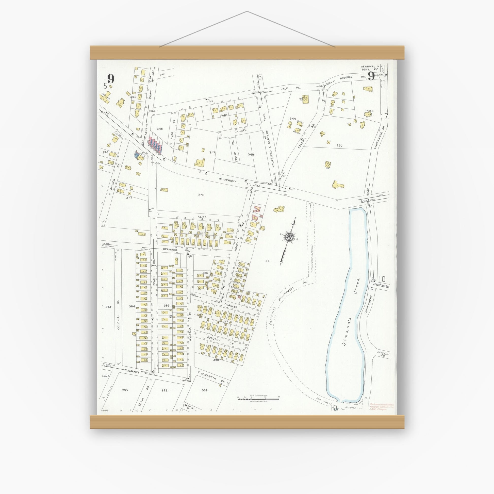 Old map wall art mockup — magnetic wood frame on white wall — Sanborn Fire Insurance Map from Merrick, Nassau County, New York (1935), Sheet #0009