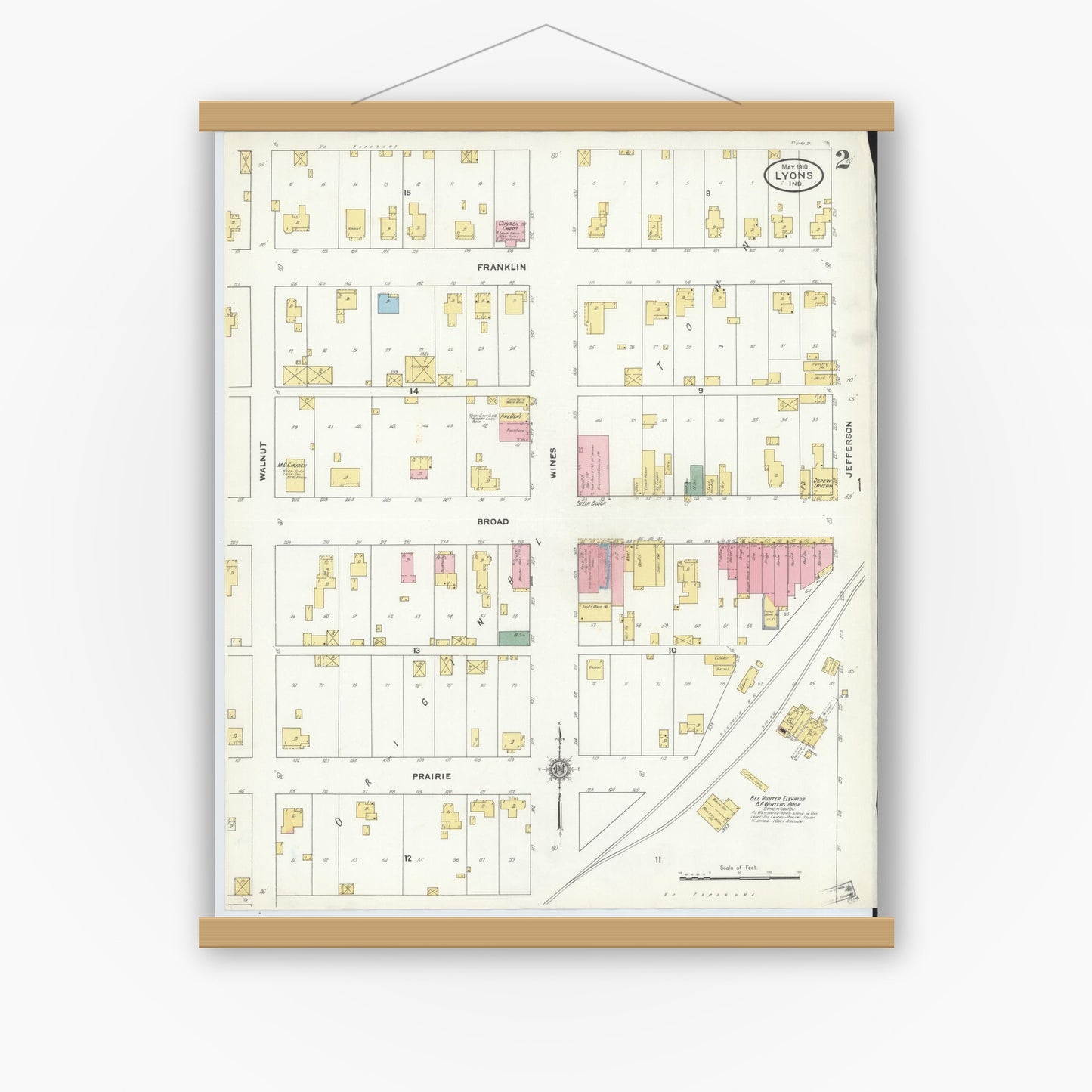 Old map wall art mockup — magnetic wood frame on white wall — Sanborn Fire Insurance Map from Lyons, Greene County, Indiana (1910), Sheet #0002
