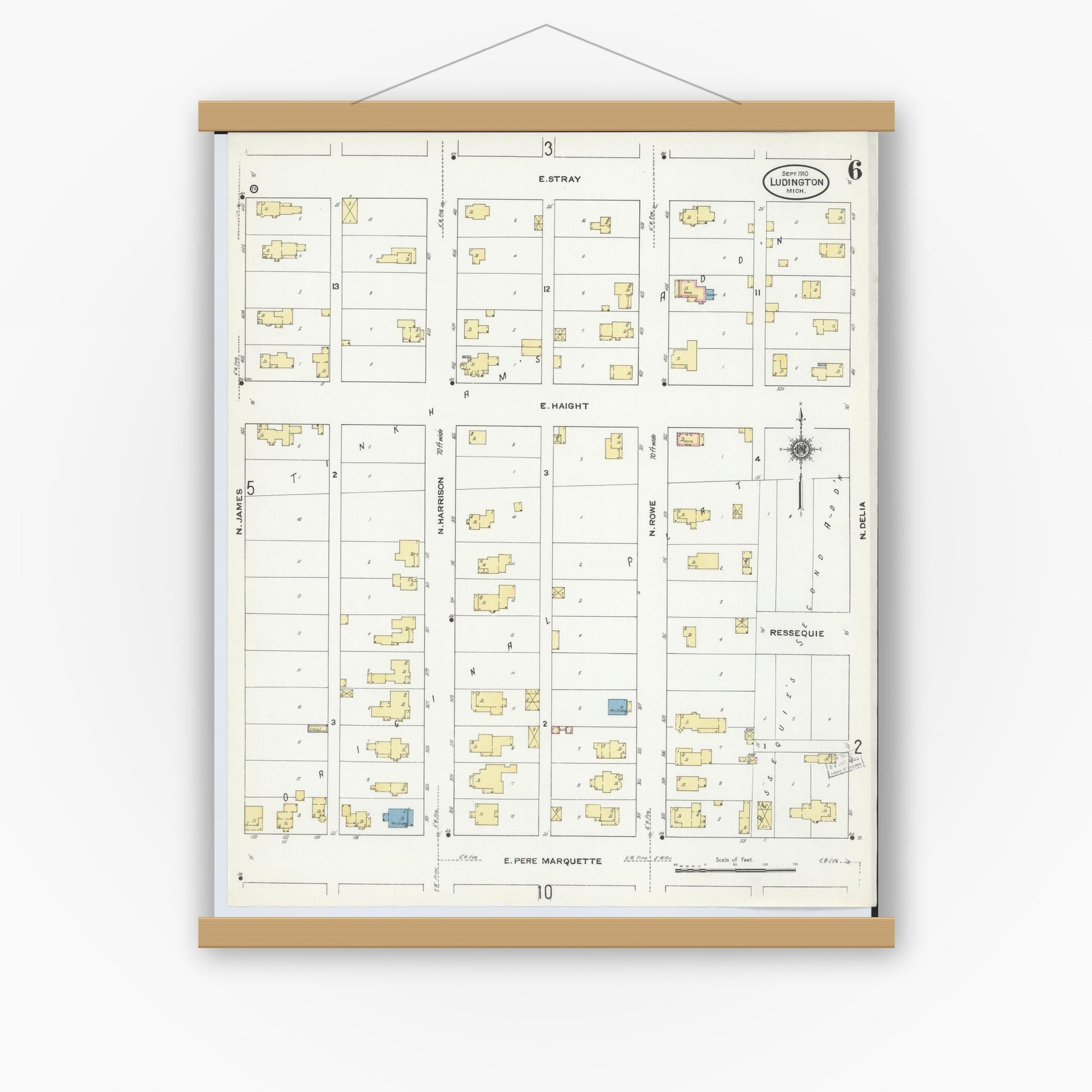 Old map wall art mockup — magnetic wood frame on white wall — Sanborn Fire Insurance Map from Ludington, Mason County, Michigan (1910), Sheet #0006