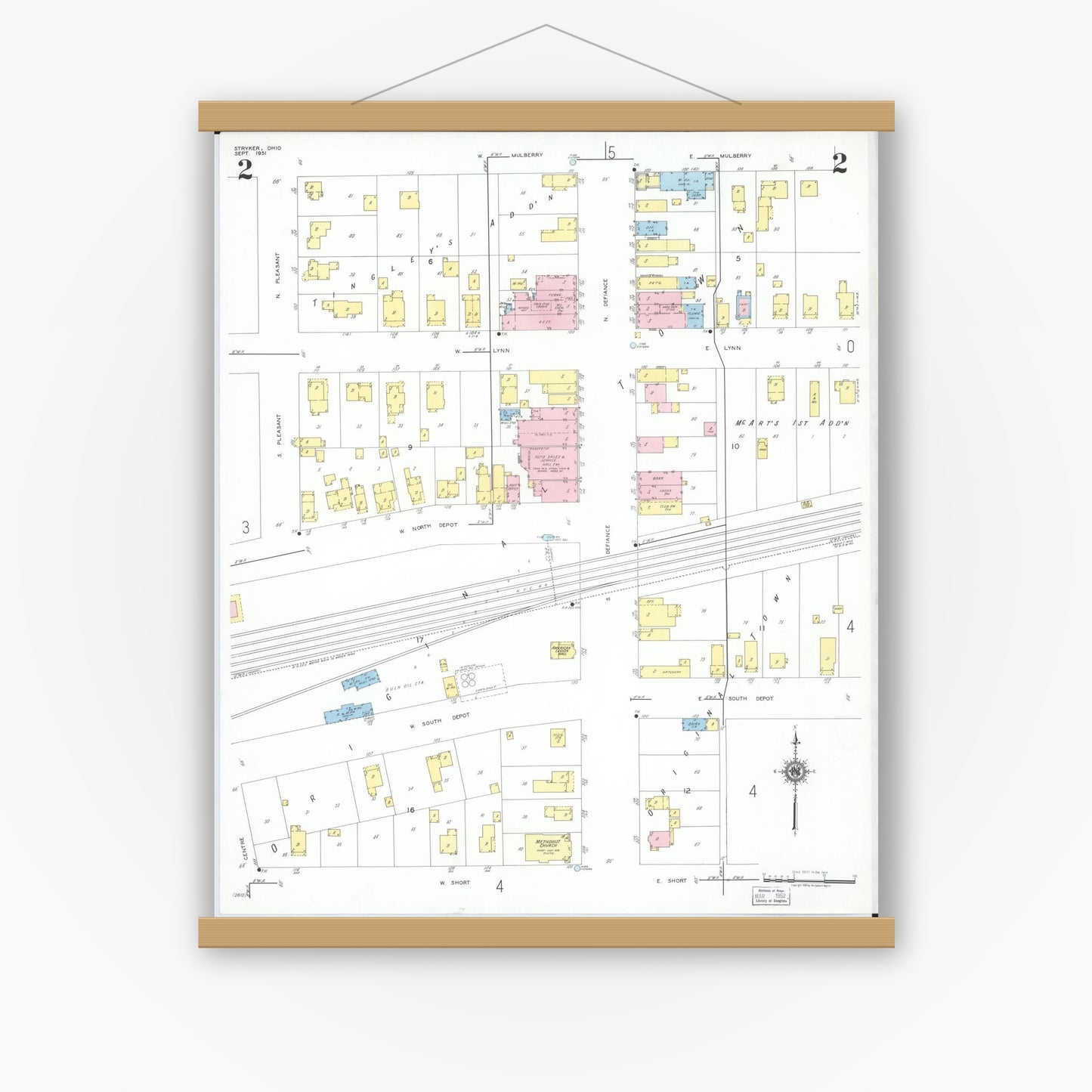 Old map wall art mockup — magnetic wood frame on white wall — Sanborn Fire Insurance Map from Stryker, Williams County, Ohio (1951), Sheet #0002