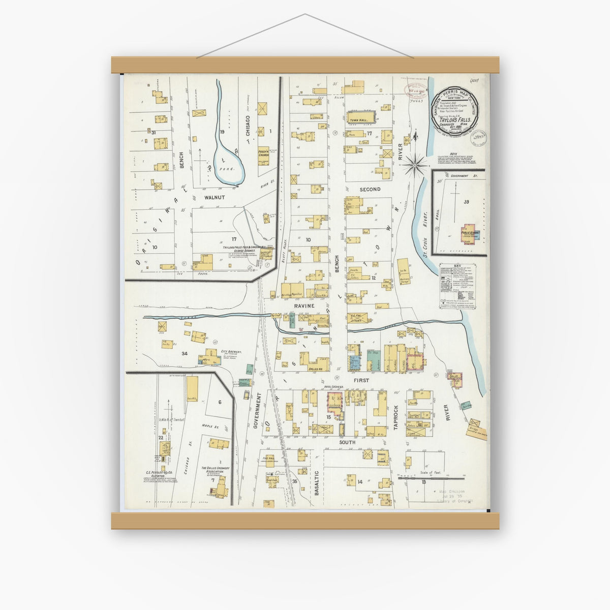 Old map wall art mockup — magnetic wood frame on white wall — Sanborn Fire Insurance Map from Taylors Falls, Chisago County, Minnesota (1899), Sheet #0001