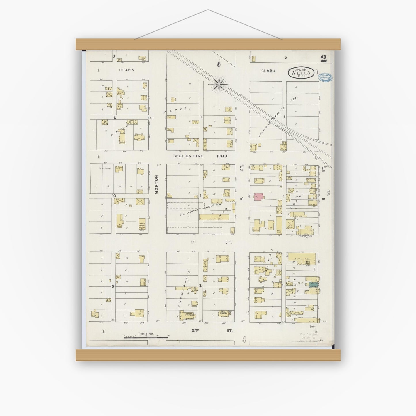 Old map wall art mockup — magnetic wood frame on white wall — Sanborn Fire Insurance Map from Wells, Faribault County, Minnesota (1894), Sheet #0002