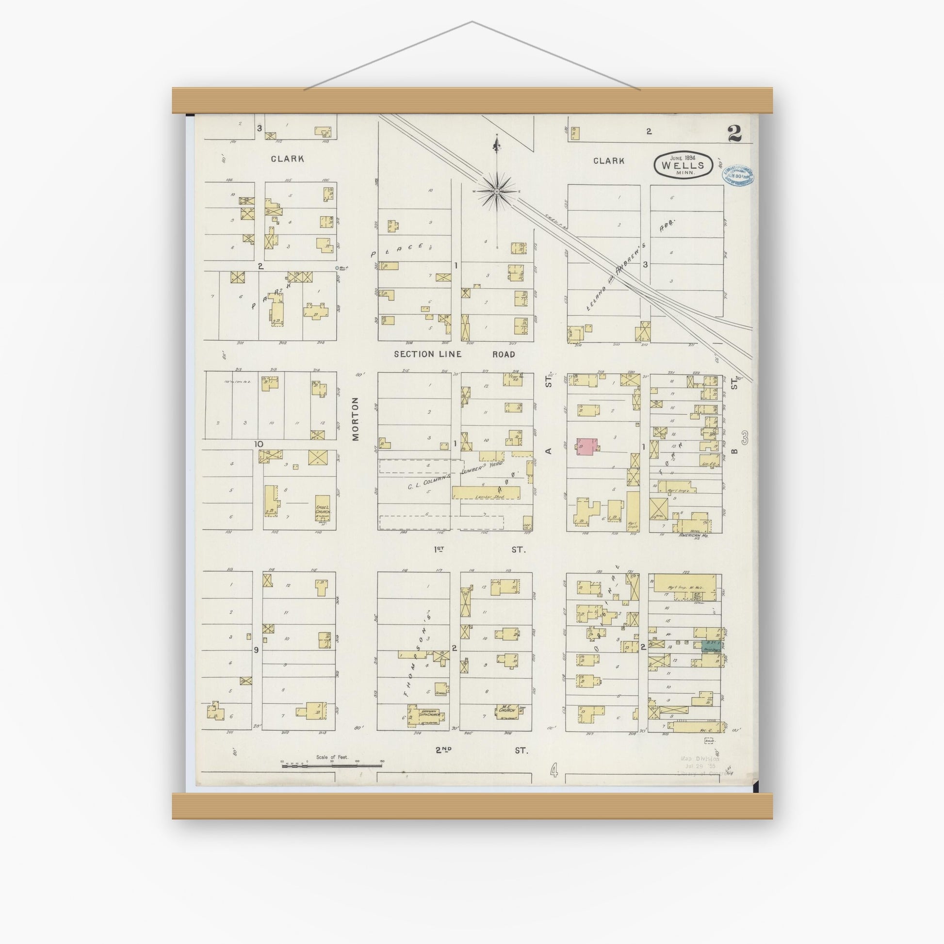 Old map wall art mockup — magnetic wood frame on white wall — Sanborn Fire Insurance Map from Wells, Faribault County, Minnesota (1894), Sheet #0002