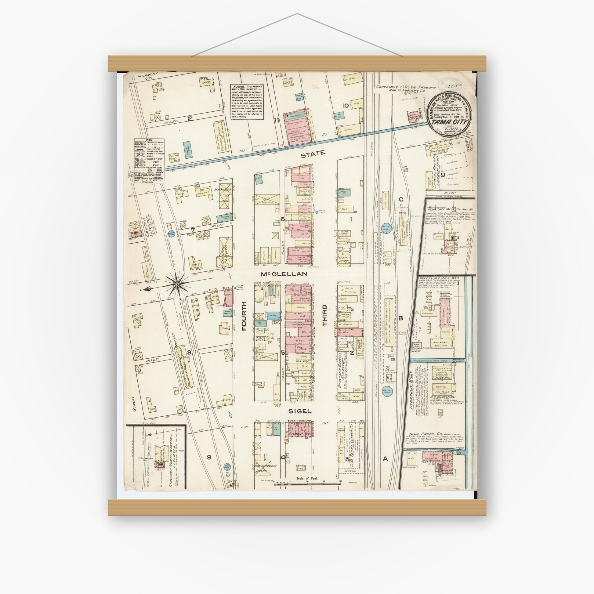 Old map wall art mockup — magnetic wood frame on white wall — Sanborn Fire Insurance Map from Tama, Tama County, Iowa (1883), Sheet #0001