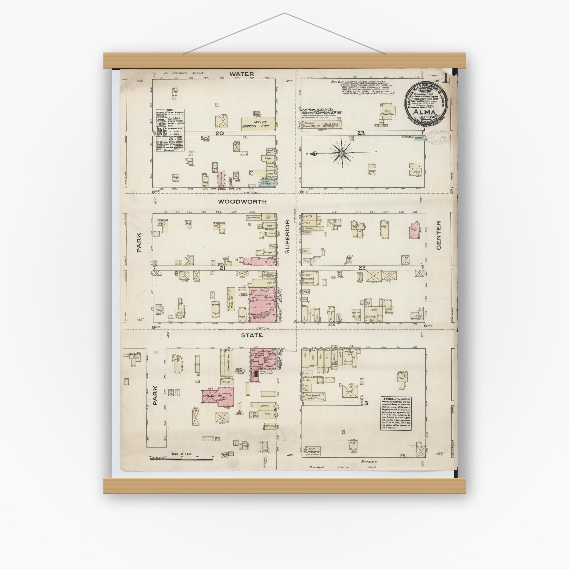 Old map wall art mockup — magnetic wood frame on white wall — Sanborn Fire Insurance Map from Alma, Gratiot County, Michigan (1884), Sheet #0001
