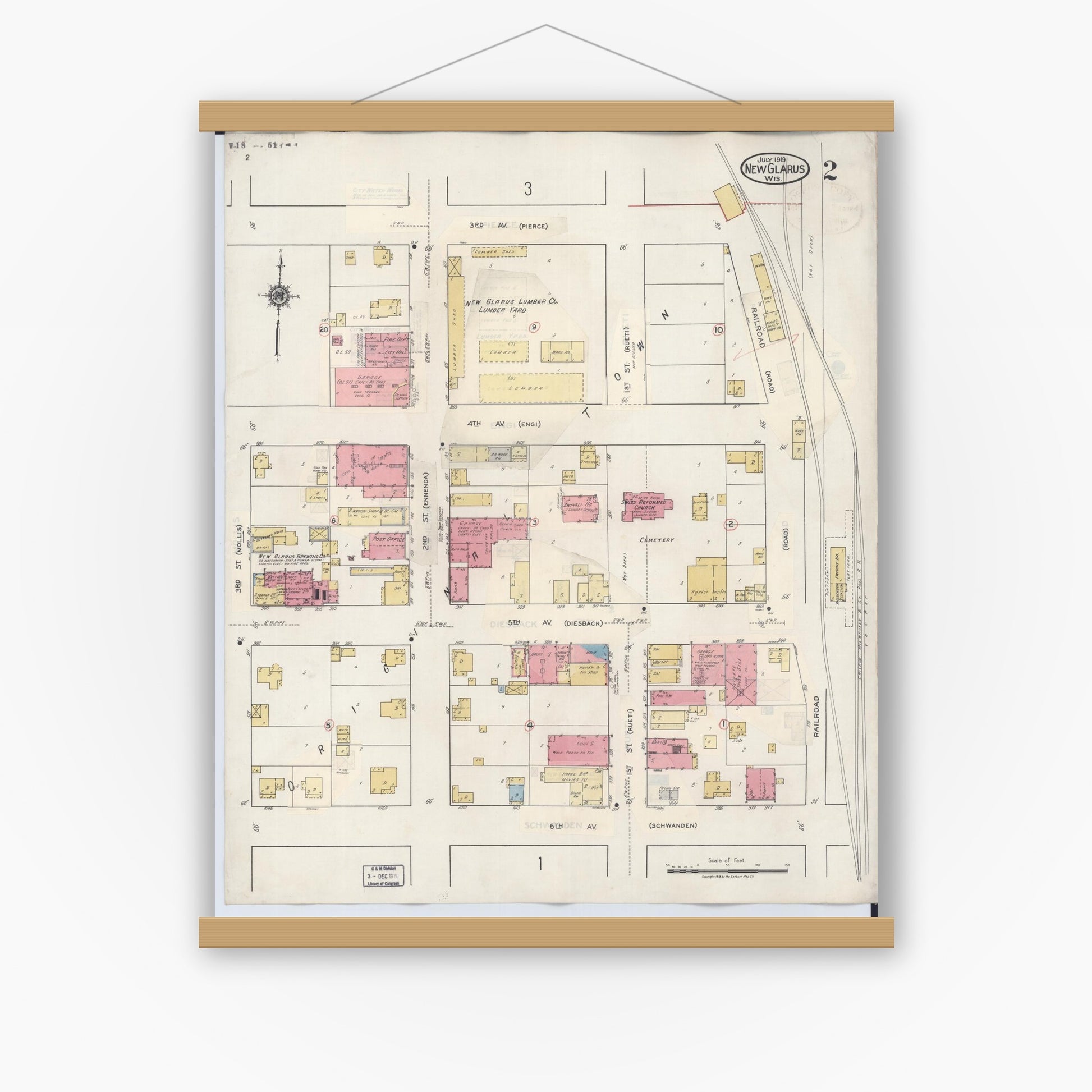 Old map wall art mockup — magnetic wood frame on white wall — Sanborn Fire Insurance Map from New Glarus, Green County, Wisconsin (1933), Sheet #0002