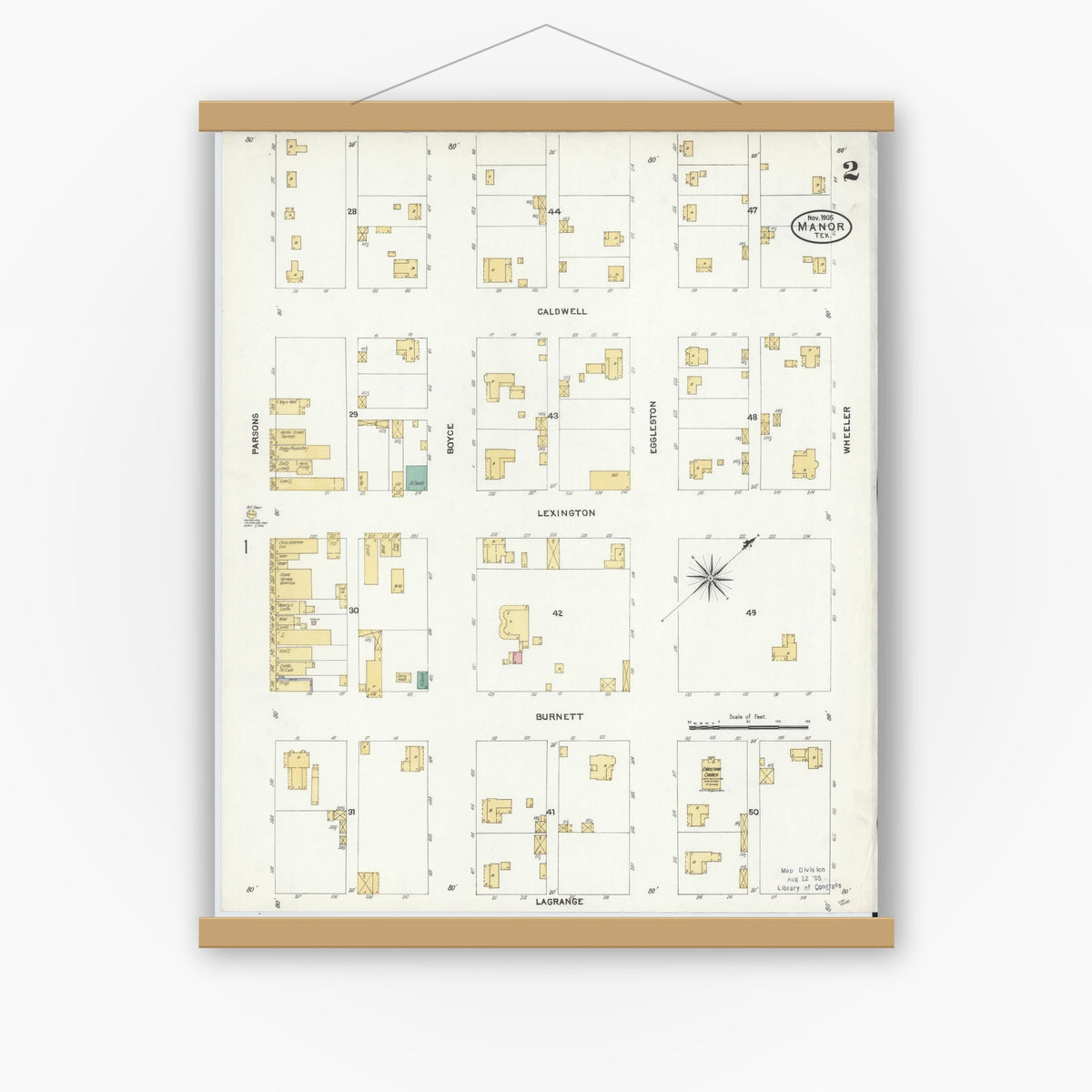 Old map wall art mockup — magnetic wood frame on white wall — Sanborn Fire Insurance Map from Manor, Travis County, Texas (1905), Sheet #0002