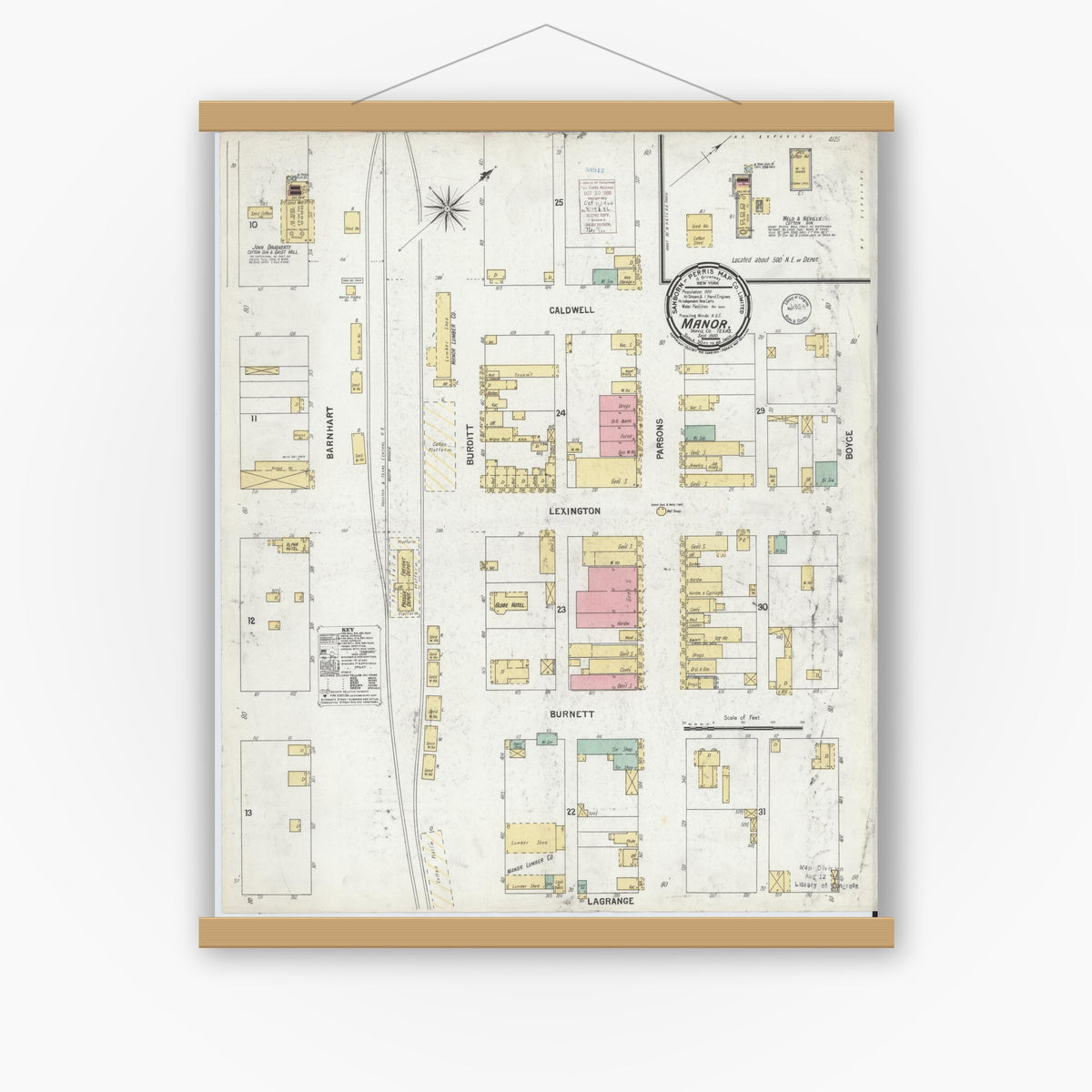 Old map wall art mockup — magnetic wood frame on white wall — Sanborn Fire Insurance Map from Manor, Travis County, Texas (1900), Sheet #0001