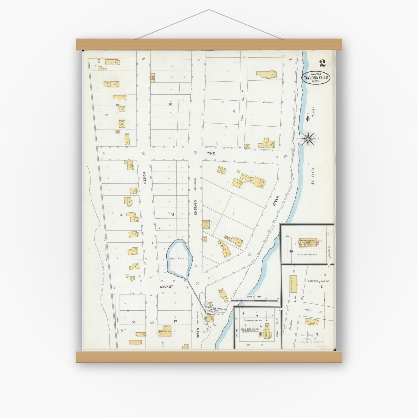 Old map wall art mockup — magnetic wood frame on white wall — Sanborn Fire Insurance Map from Taylors Falls, Chisago County, Minnesota (1904), Sheet #0002