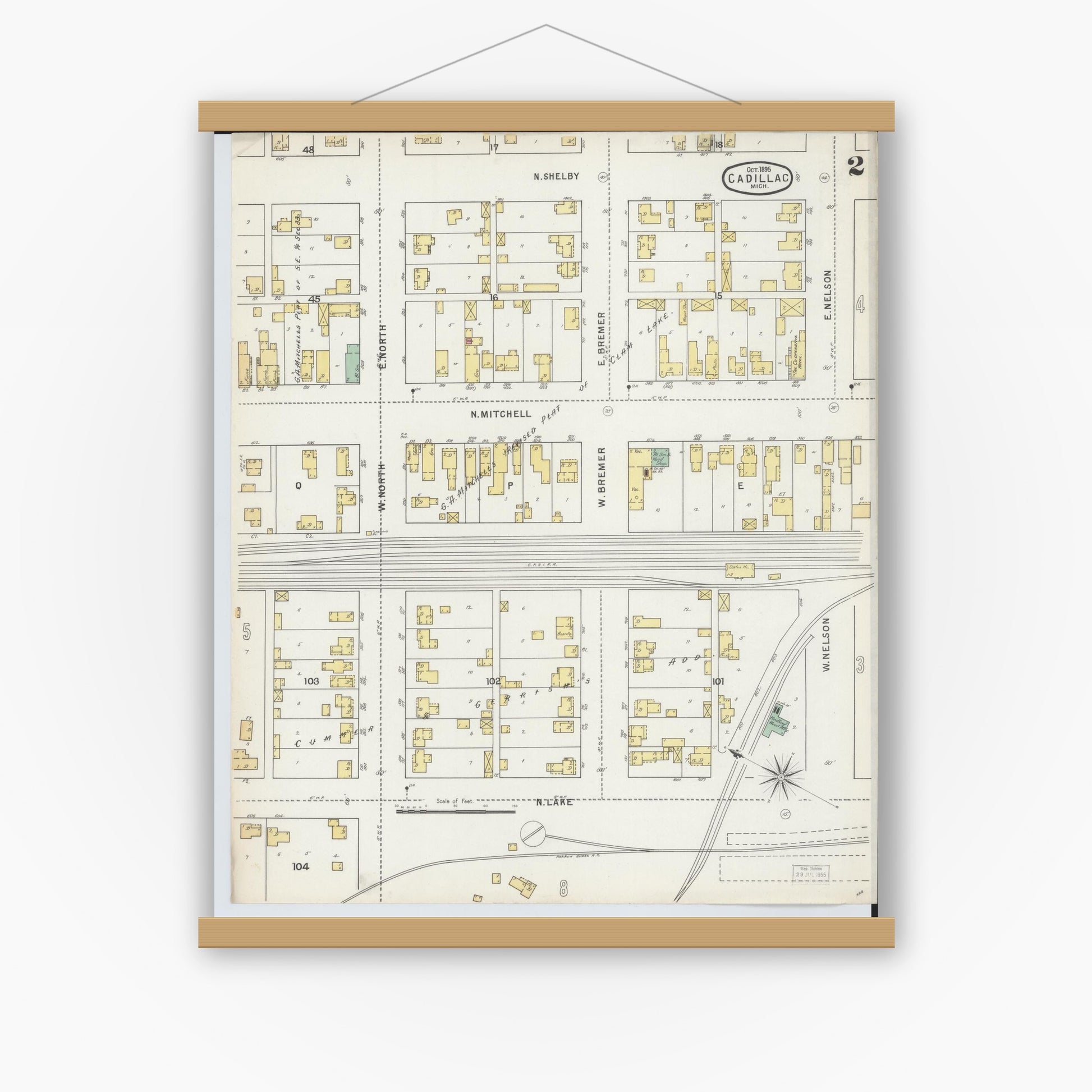 Old map wall art mockup — magnetic wood frame on white wall — Sanborn Fire Insurance Map from Cadillac, Wexford County, Michigan (1895), Sheet #0002