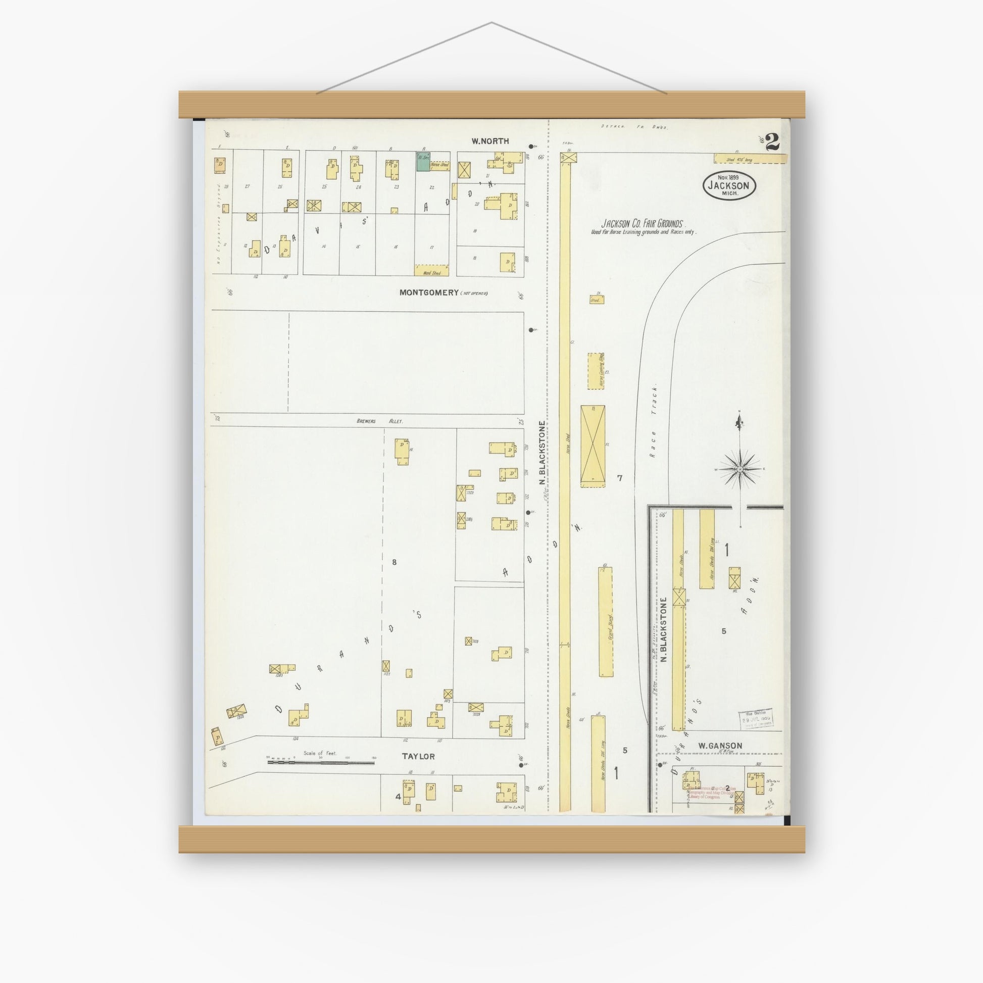Old map wall art mockup — magnetic wood frame on white wall — Sanborn Fire Insurance Map from Jackson, Jackson County, Michigan (1899), Sheet #0002