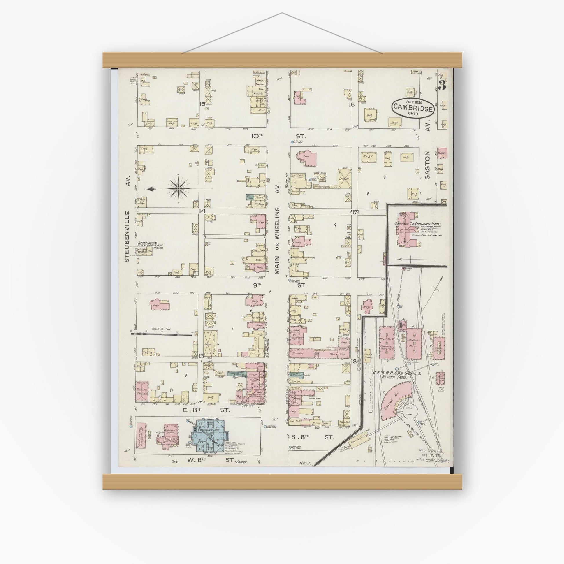 Old map wall art mockup — magnetic wood frame on white wall — Sanborn Fire Insurance Map from Cambridge, Guernsey County, Ohio (1886), Sheet #0003
